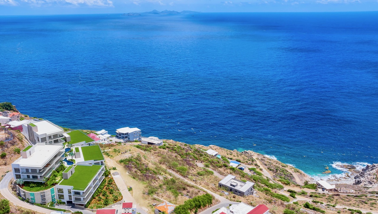 Aerial coastline view of Panorama Residences above the Caribbean Sea.