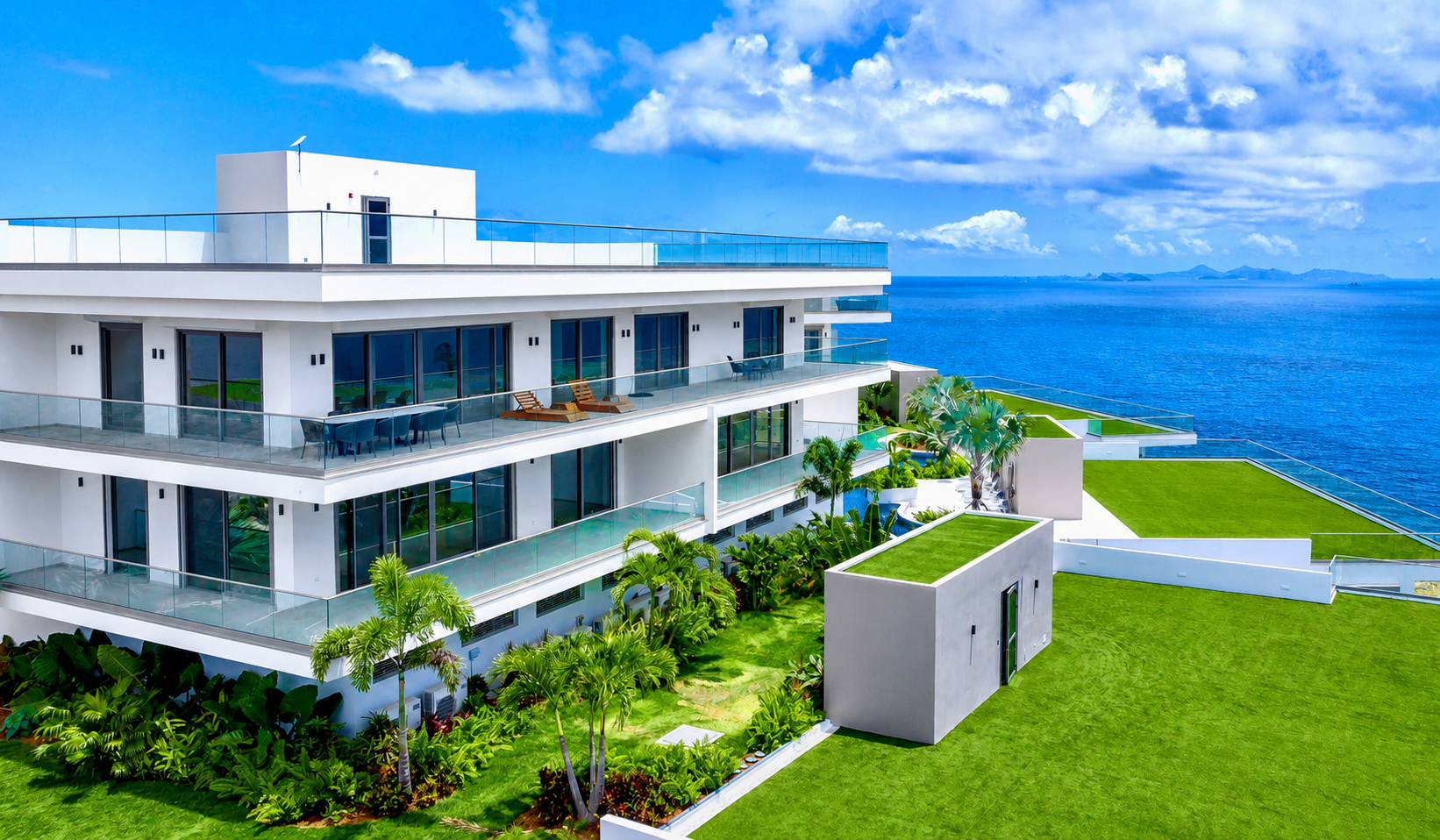Panorama Residences building with private terraces, tropical gardens and wide ocean views.