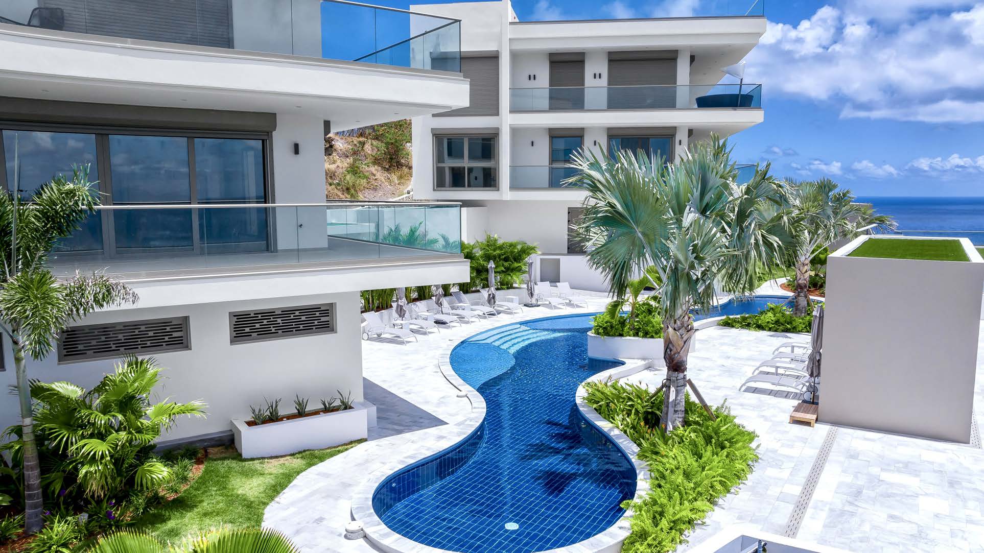 Free-form pool and tropical gardens at Panorama Residences.